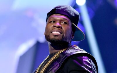50 Cent hurls a microphone offstage during a concert, allegedly hits a woman
