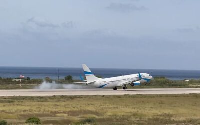 Terrifying video shows passenger jet rocking from side to side before thudding into runway and another aborting landing during storm on Greek holiday island